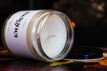 Load image into Gallery viewer, Beignet New Orleans Candle in 8oz clear candle jar laying on side
